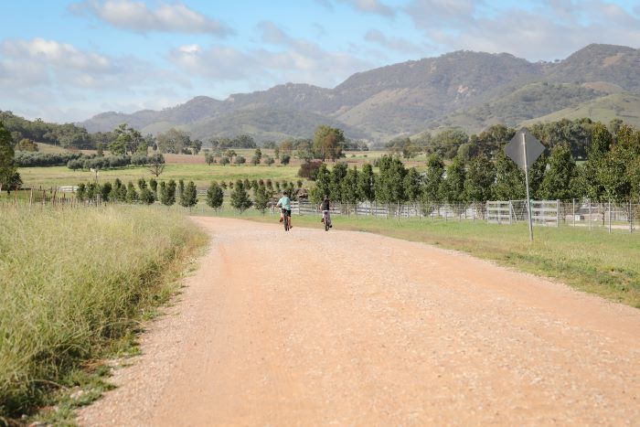 Image of two brothers riding bikes on a country road in Mudgee in the Central West and Orana region
