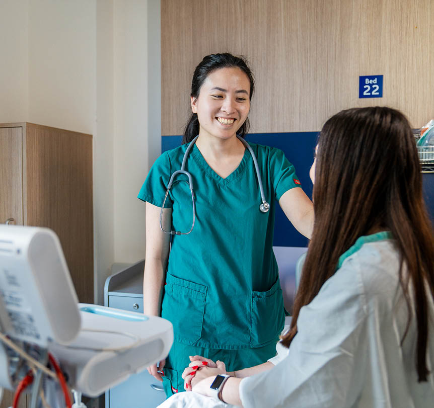 A nurse with a patient in a ward
