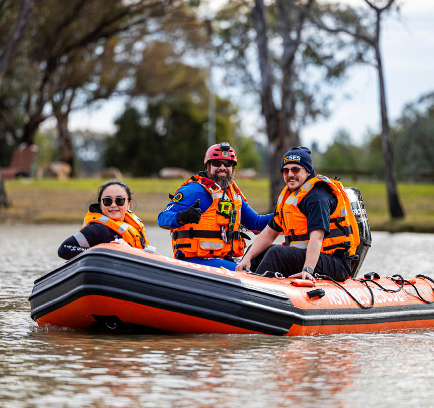 A group of SES volunteers on a boat on a lake