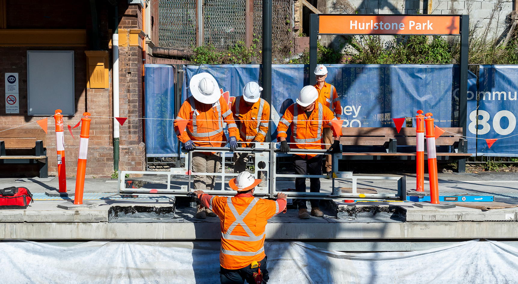 A group of construction workers doing trackwork at Hurlstone Park station